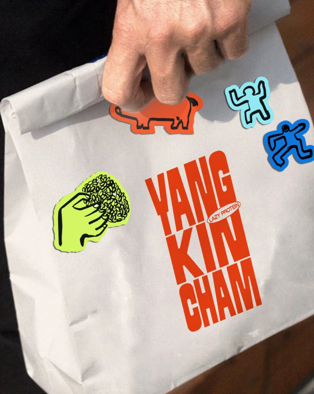 Yang Kin Cham takeaway bag with stickers